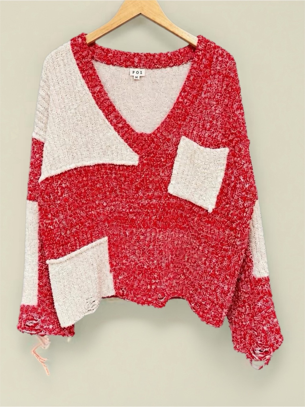 Distressed Red & Cream Patchwork V‑Neck Sweater